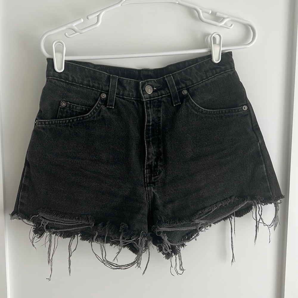 Faded black cutoff Levi’s shorts orange tag